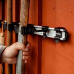 Toolflex holder - Man taking shovel from Toolflex holder